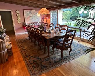 This formal dining table can fit 10 places.  It is a larger piece than often found.  Don't overlook the rug either.  