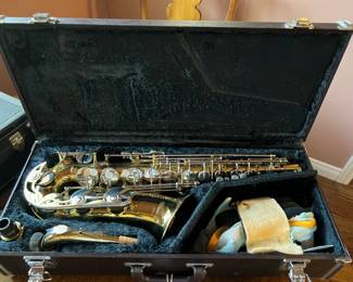 This is a Yamaha tenor saxophone inside it's case.  It was well-cared for.