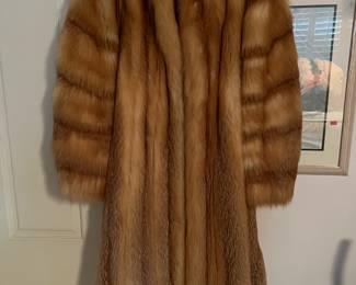 This is a vintage, real-fur coat, in excellent condition.
