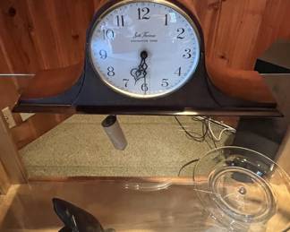 On the shelf in the same room is this mantle clock.