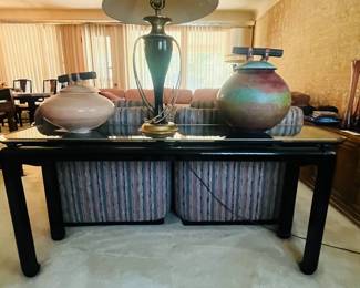 A classic black lacquer And glass coffee table.