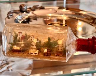Vintage small bottle with miniature Village inside