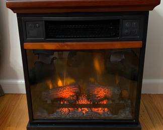 Space saving “fireplace” heater. Works perfectly! Instruction included. 