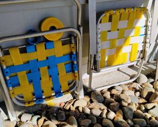 Two Aluminum Webbed Folding Lawn Chairs