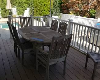 Teak dining set by Neiman Marcus