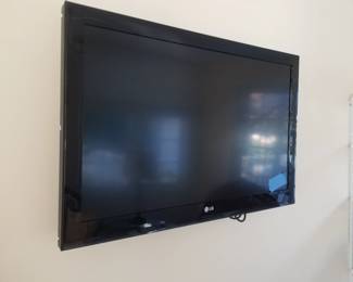 Flat screen TV with wall bracket