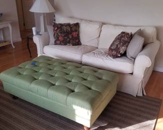 Neutral couch; green tufted ottoman