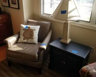 Leather arm chair; blue cabinet