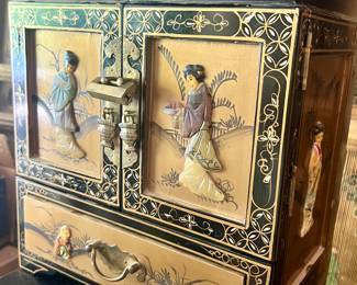 Old war era jewel case with carved stone accents