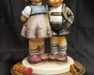 Lot # : 426 - M.I Hummel club Goebel figurine with wood base.
