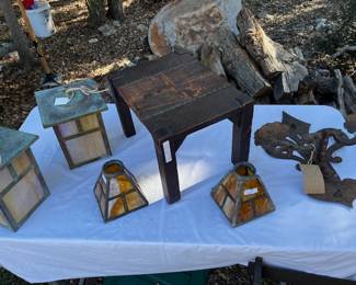 Authentic Arts and Crafts lamps, shade and stool plus what appears to be a religious iron sconce.