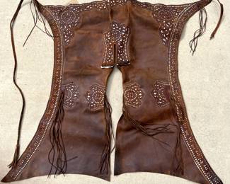 Spanish leather chaps with immense overlay and cut work. Note the fringe.
