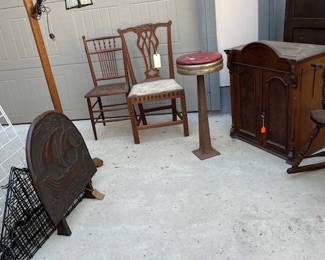 Its and crafts floor lamp,  and center chair is authentic 1700's. Old drugstore stool and Nautical cabinet.