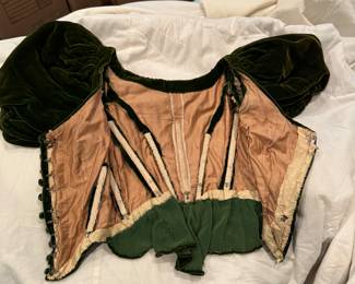 Turn of the century women's forest green bustier style top. Has whalebone stays sewn in.