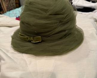 Vintage woman's Eric Javits olive green tulle hat with velvet bow.