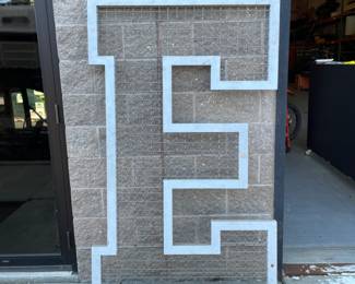 Large decorative letter “E”