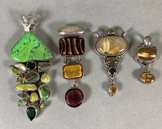 Four Sterling Silver With Multi Colored Clear And Solid Stone Pendants