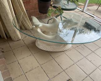 Dolphin based coffee table with glass top.
