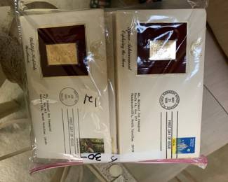#121 11 gold collectable stamps with envelopes $30.00