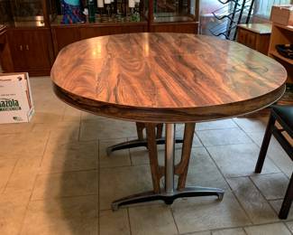 #107 oval laminate midcentury table with chrome legs 54x42x29 $50.00