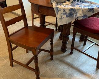 Great oak farmhouse style round oak table with chairs and two leaves