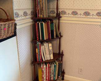 Cute corner shelf filled with cookbooks