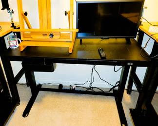 Black Motorized Standing Desk. Chair included
