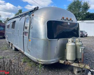 1970 Air Stream Auto Land Yacht, bumper pull trailer Over Lander