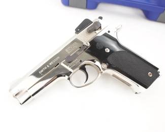 Make: Smith & Wesson
Model: 459 2nd Gen
Caliber: 9MM
Action: Semi
Barrel: 4
Bore: Bright
Serial # A811499
Condition: Great
Manufactured from 1981-1989. Second generation alloy frame double-stack semi automatic pistol based on the first generation Model 59. Early variant had a rounded trigger guard and safety lever on left side only. Later variant had a squared trigger guard and ambidextrous safety levers. Fixed and adjustable sight variants. These Pistols were manufactured for the US XM9 Pistol trials. Chambered in 9MM and features a 4” barrel and a Shiny Finish. This pistol Remains in great condition showing normal signs of use and wear. Sold with Smith and Wesson Hard case.