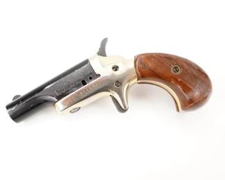 Make: Butler Assoc. Inc.
Model: Butler Derringer
Caliber: .22 CAL Short
Action: Break
Barrel: 2.5
Bore: Bright
Serial # B52601
Condition: Good/Broken
Butler Assoc inc. Single shot, spur trigger Derringer, chambered in .22 short, manufactured circa 1960's-1970's. Butler produced these derringers for Colt between 1959-1963. When Colt dropped the line Butler continued production and stamped their own name on the guns. Features a black finished 2.5" swing out barrel, fixed round blade front sight, gold plated frame, smooth spur trigger, knurled hammer spur, and two-piece smooth walnut bird's head grips. This Pistol appears to be missing the locking pin.