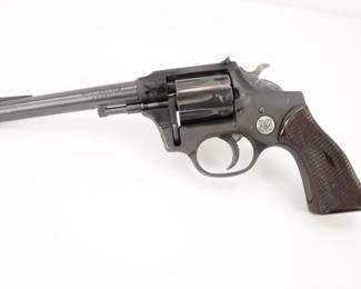 Make: High Standard
Model: R-101
Caliber: .22 Cal
Action: DA
Barrel: 6
Bore: Bright
Serial # 637425
Condition: Very Good
The Sentinel was a 9-shot .22 revolver. It was advertised to have an anodized aluminum frame, high-tensile carbon steel barrel and cylinder, single-stroke multiple ejection, a swing-out counterbored cylinder, a movable square-notched rear sight, a non- slip scored trigger, a diamond-checkered grip (though they didn’t mention it was plastic), and target accuracy. The revolver is in very good condition, showing normal signs of use and wear. 
