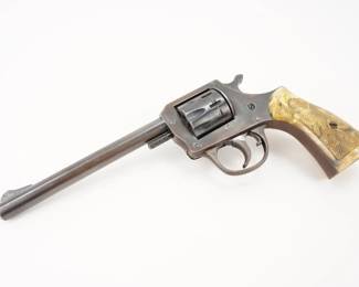 Make: H&R
Model: 922
Caliber: .22
Action: DA
Barrel: 5.75
Bore: Bright
Serial # U27778
Condition: Very Good
The H & R Model 922 revolver was manufactured between 1927 and 1982. The first issue was made from 1927 until the end of 1949 and was offered with a 2.5", 4" and 6" barrel, with fixed sights, checkered walnut grips and a blued finish. The second issue was produced from 1950 through 1982, Had the same barrel lengths, but black plastic grips. The revolver is in very good condition, showing normal signs of use and wear.
