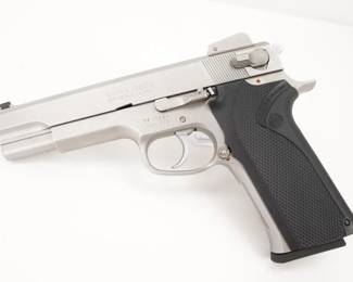 Make: Smith & Wesson
Model: 1006
Caliber: 10mm
Action: Semi
Barrel: 4.8
Bore: Bright
Serial # TFH7524
Condition: Great
Country: Pistol
Manufactured from 1990-1995. The Smith & Wesson Model 1006 is a recoil operated double-action/single-action semi-automatic handgun chambered in the 10mm Auto cartridge manufactured by Smith & Wesson. The 1006 is a full-size, all stainless steel pistol with a 5-inch barrel. It utilizes a single stack magazine holding nine rounds. This pistol is in Great condition showing normal signs of use and wear. 