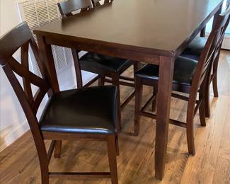 Dark wood high top table with 6 chairs