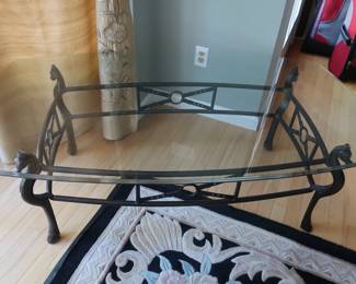 glass  top  coffee  table    with  metal  legs  30"  x  53"  There  are  two  lamp  tables  that  match  this.