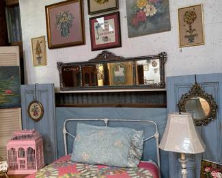 twin metal bed and cute art