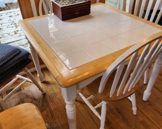 White Tile Top Square Table with 5 White Chairs. 