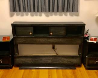 The Black 5 piece (Plus mirror) Bedroom Set $300 4 pieces have glass tops. The tall chest of drawers is 38 inches long by 20 inches deep 48 inches tall.
The Black Long Dresser is 64 inches long 20 inches deep. The base is 33 inches tall. The mirror is 56 inches long. I’m 33 1/2 inches tall. There is a corner of the glass broken.
The 2 Nightstands are 22 inches long 15 1/2 inches deep and 26 inches tall.
The Black Headboard and Footboard are 58 inches long 10 inches deep and 38 1/2 inches tall. $300