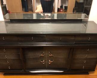 The Black 5 piece (Plus mirror) Bedroom Set $300 4 pieces have glass tops. The tall chest of drawers is 38 inches long by 20 inches deep 48 inches tall.
The Black Long Dresser is 64 inches long 20 inches deep. The base is 33 inches tall. The mirror is 56 inches long. I’m 33 1/2 inches tall. There is a corner of the glass broken.
The 2 Nightstands are 22 inches long 15 1/2 inches deep and 26 inches tall.
The Black Headboard and Footboard are 58 inches long 10 inches deep and 38 1/2 inches tall. $300