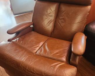 Brown leather recliner with chrome base. Has minor wear and tear, but still looks great! Very comfortable as well! 