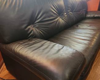 Black leather couch. very comfy! Has some wear & tear, but looks very nice! 