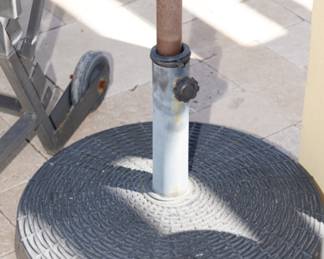 There are two patio umbrella bases available and two umbrellas-sold separately.