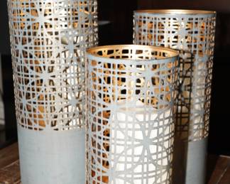 Latticed metal candle holders with candles-being sold as a set