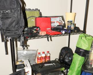 Storage rack with loads of camping gear