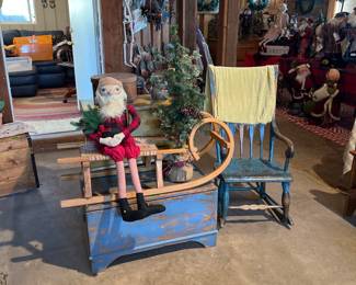 Blue chest/toy box $75,mustard cupboard $250, blue rocking chair $100, old sled $150