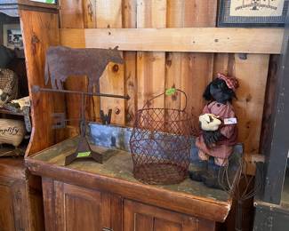 Tin lined dry sink $400, cow weathervane $175, red wire basket $25