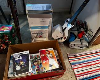 Wii console and additional attachments. Comes with a couple of games but most game boxes are empty
