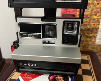 Polaroid Sun 600 camera and film