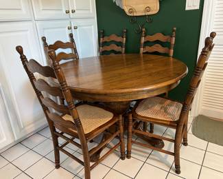 Oak Table and 4 ladder back chairs with caned seat ( 5th chair needs new cane)
