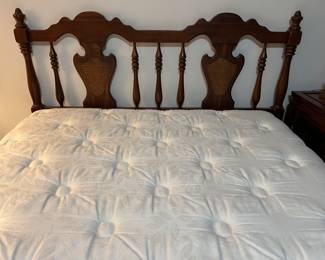 Full Size Cherry Bed with caned panels and spotless mattress.  Has matching Dresser too.  